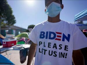 Migrant Wears Biden T-Shirt at Border: "So They Can Let Me In"